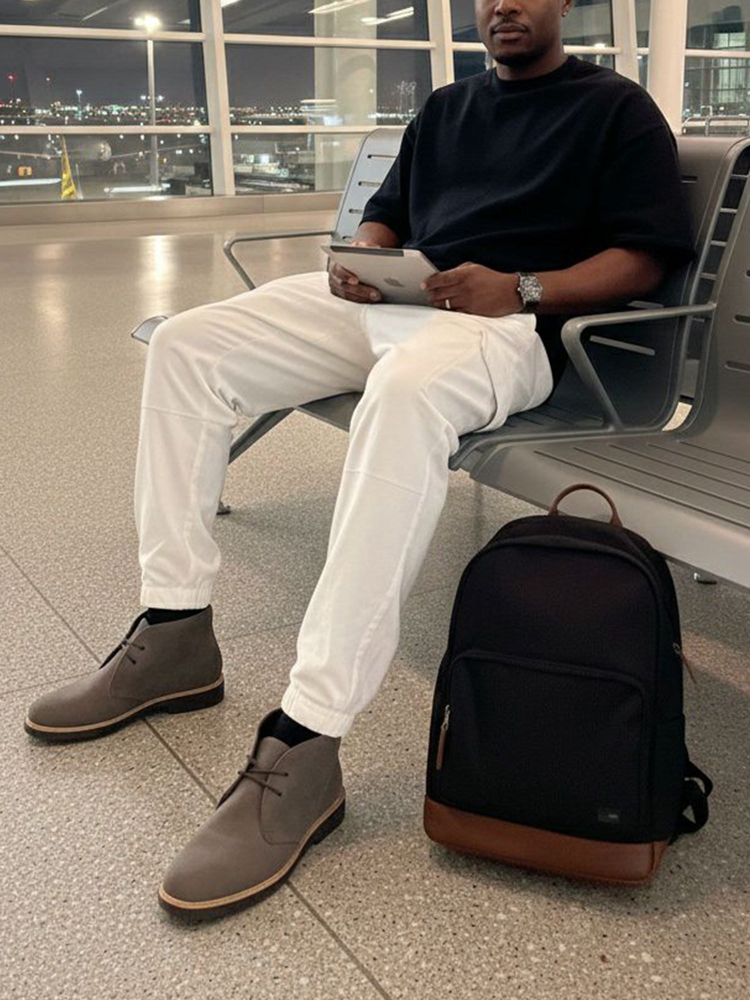 brown leather backpack with black shoes Vegan Large Backpack