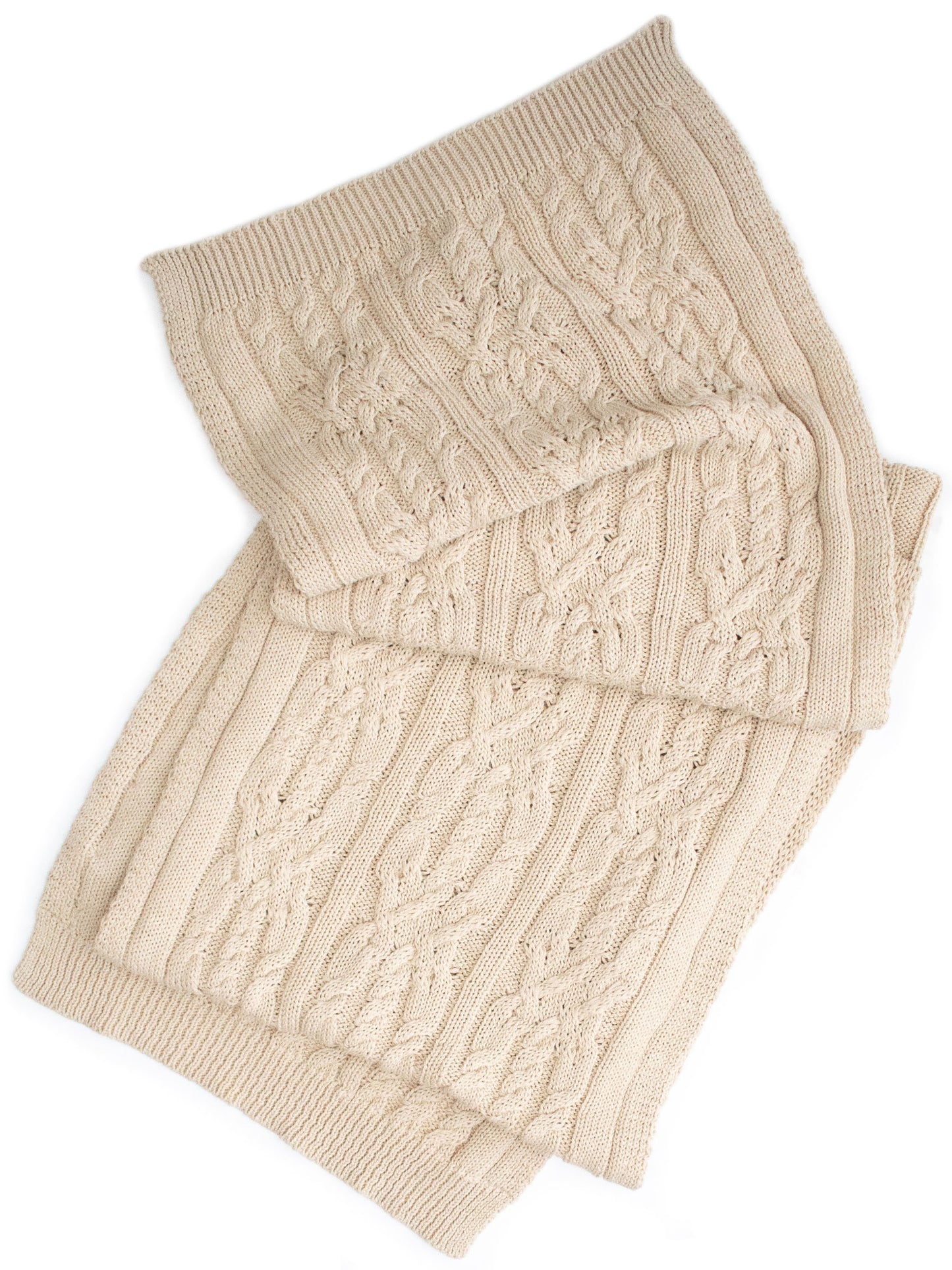 A Knitted Scarf With A Thick Thread On Thick Beige Knitting